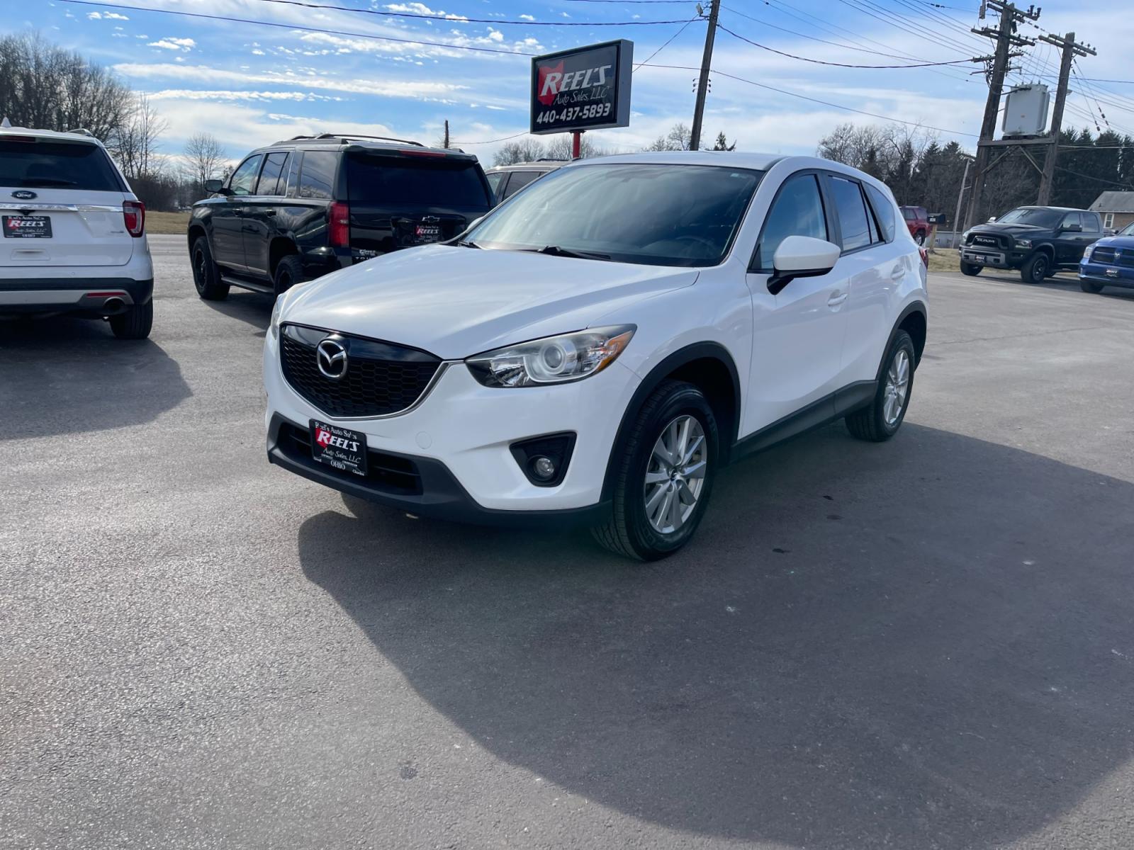 2015 White /Black Mazda CX-5 Touring AWD (JM3KE4CYXF0) with an 2.5L I4 DOHC 16V engine, 6-Speed Automatic transmission, located at 547 E. Main St., Orwell, OH, 44076, (440) 437-5893, 41.535435, -80.847855 - This 2015 Mazda CX-5 Touring AWD is a well-equipped SUV that offers a blend of performance, safety, and convenience for its drivers. Being a one-owner vehicle as per its Carfax report signifies well-attended maintenance and care. It is loaded with advanced features such as Blind Spot Monitoring and - Photo #0
